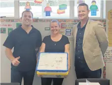  ??  ?? Andrew (left) and Rhys (right) from Foster Develop delivering two giant LEGO education kits to Kim Breen at Ōmokoroa Point School. PHOTO: Rachel Millard.