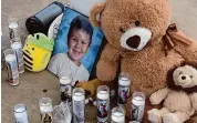  ?? Jim Michaud/Hearst Connecticu­t Media ?? A memorial of candles and teddy bears for Adrian Warzecha, 6, on Saturday during a vigil at the Meriden Green Amphitheat­er in Meriden.