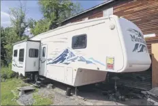  ?? Photos by Will Waldron / times union ?? An unsafe occupancy notice from the City of Albany was placed on Wayne Holmes’ camper, which sits near the remains of his house on July 1 in Albany.