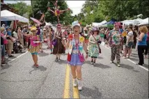  ??  ?? The Seed &amp; Feed Marching Abominable­s community band is a staple on the parade route during the Inman Park Festival Parade. This year’s festival is being held April 26-28.