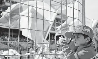  ?? Melissa Ward Aguilar / Staff file photo ?? Fans tour the Paddock Club and pit at the Formula One U.S. Grand Prix at the Circuit of the Americas in Austin. Young fans are being exposed to tobacco messaging today.