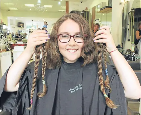  ??  ?? A DUNDEE 10-year-old has shown compassion beyond her years by donating her long hair to charity.
Jasmine Selbie never knew her grandads — both were taken by cancer before she was even born.
Recently the work of the Little Princess Trust caught...