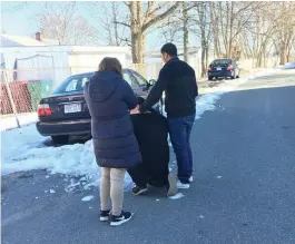  ?? ALANA MELANSON PHOTOS / LOWELL SUN ?? ANGUISH: Tony Iem, with his wife, Vany Iem, and friend Michael Chea, visit the site where his brother, Jimmy Iem, was shot and killed Saturday night in Lowell.