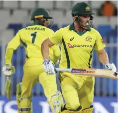  ??  ?? Australian cricketers Aaron Finch and Usman Khawaja (left) run between the wickets during the second one day internatio­nal (ODI) cricket match between Pakistan and Australia in Sharjah, in the United Arab Emirates. — AFP photo