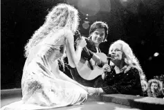  ??  ?? French actress Jeanne Moreau (Right), President of the Jury at the 48th Cannes Film Festival, sings with Vanessa Paradis as part of the opening evening programme of the festival in Cannes, France, May 17, 1995. — Reuters/AFP photos