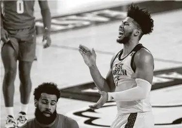  ?? Photos Karl B DeBlaker / Associated Press ?? East Carolina's Jayden Gardner enjoys the closing minutes of the Pirates’ first victory since Dec. 22 and first against a Top 25 team since beating Marquette in 2002.