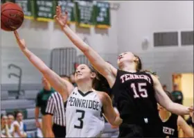  ?? BOB RAINES — DIGITAL FIRST MEDIA ?? Pennridge’s Sophie Cweiber and Tennent’s Emma Stanfield stretch for a rebound Friday night.