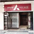  ?? PIC/NAVEEN SHARMA ?? L-R: The Noida branch of Axis Bank that was sealed for the day during the I-T raid; the CP branch of the bank bears a deserted look after the raid