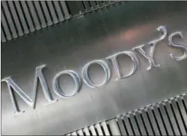  ?? MARK LENNIHAN — THE ASSOCIATED PRESS FILE ?? This August 2010 file photo shows a sign for Moody’s Corp. in New York. Concerns are building from Washington to Wall Street about the trillions of dollars in debt that U.S. businesses have racked up, particular­ly by companies with relatively weak finances.