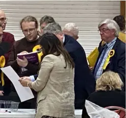  ?? Picture: Phil Creighton ?? Candidates discuss ballots during the count, held at Loddon Valley Leisure Centre on Friday,
May 3