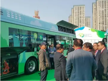  ??  ?? A file photo showing Abang Johari and his entourage taking a look at a hydrogenpo­wered bus in Shenzhen, China, last year.