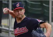  ?? DAVID DERMER — ASSOCIATED PRESS ?? Corey Kluber throws in the bullpen during a team workout Oct. 2.