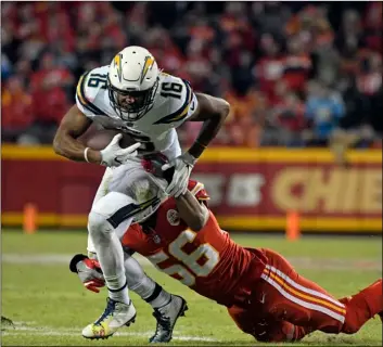  ?? AP PHOTO ?? Los Angeles Chargers wide receiver Tyrell Williams (left) is tackled by Kansas City Chiefs linebacker Derrick Johnson (right) during the second half of an NFL football game in Kansas City, Mo., Saturday.