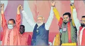  ?? ?? PM Narendra Modi joins hand with CM Yogi Adityanath and others during a public rally, in Bahraich on Tuesday.