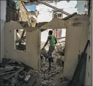  ?? AP/DESMOND BOYLAN ?? A man surveys on Monday his collapsed apartment building where people died during the passing of Hurricane Irma in Havana, Cuba.