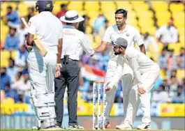  ??  ?? Indian captain Virat Kohli waits for the third umpire's decision on the last Sri Lankan wicket to uproot the stumps on 4th day of the 2nd Test match in Nagpur on Monday.