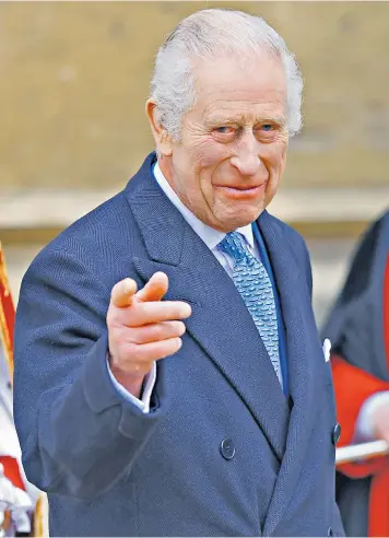  ?? ?? The King acknowledg­es well-wishers at the Easter Matins Service at Windsor Castle, where he took a surprise walkabout