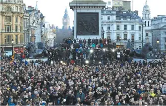  ?? THE ASSOCIATED PRESS ?? Crowds gather at a vigil for the victims of Wednesday’s attack, at Trafalgar Square in London on Thursday.