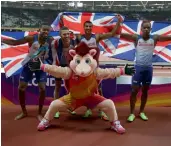  ??  ?? Britain’s Nethaneel Mitchell-Blake, Daniel Talbot, Adam Gemili and Chijindu Ujah pose with the mascot after winning the men’s 4x100m relay. — AFP