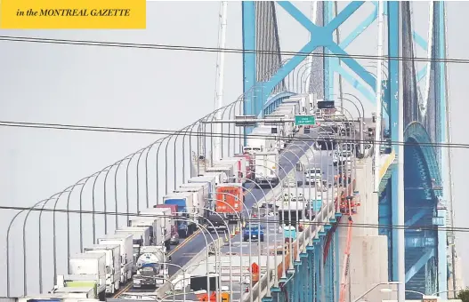  ?? DAN JANISSE / POSTMEDIA NEWS ?? Trucks heading into Canada at the Ambassador Bridge in Windsor were backed up the length of the crossing on Friday. Similar delays occurred at crossings across the country.
