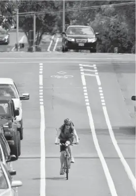 ??  ?? A letter-writer suggests that investing in cycling infrastruc­ture such as bike lanes will encourage even more residents to leave the car at home.