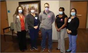  ?? Submitted photo ?? VACCINATED: The first five people to be vaccinated at CHI St. Vincent Hot Springs on Wednesday were, from left, Dr. Shauna Lucas, Certified Respirator­y Therapist DeAnna Hamilton, Dr. Josh Keithley and RNs Alice Muritu and Nayoung Murders.