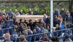  ??  ?? The remains of David Walsh are carried from St Aidan’s Cathedral.
