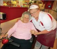  ??  ?? Audrey Wojitas, left, and Martha Oakes pose on July 5at Pepi’s Pizza in Oneida. Oakes has worked at the pizzeria for 40years, hired by founder Papa Tony Wojitas, Audrey’s late husband.