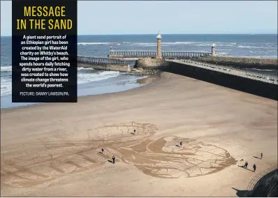  ?? PICTURE: DANNY LAWSON/PA. ?? A giant sand portrait of an Ethiopian girl has been created by the WaterAid charity on Whitby’s beach. The image of the girl, who spends hours daily fetching dirty water from a river, was created to show how climate change threatens the world’s poorest.