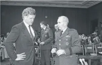  ?? | CHARLES TASNADI/ AP ?? Gen. John W. Vessey talks with Sen. Edward Kennedy, D- Mass, in 1983. Vessey served in World War II and the Vietnam War and was awarded the Distinguis­hed Service Cross.