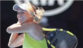  ?? LUTTIAU NICOLAS/PRESSE SPORTS/USA TODAY SPORTS ?? Caroline Wozniacki, above, rallied from a first-set loss to defeat Jana Fett 3-6, 6-3, 7-5 on Wednesday in the second round in the Australian Open.