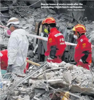  ?? Photo / Mark Mitchell ?? Rescue teams at work a week after the devastatin­g Christchur­ch earthquake.