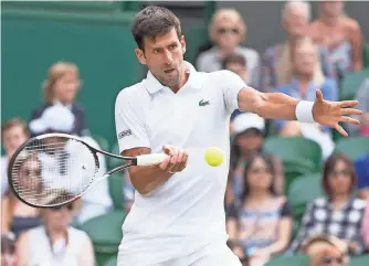  ?? PHOTOS BY SUSAN MULLANE, USA TODAY SPORTS ?? Novak Djokovic retired in his quarterfin­al match due to a bothersome right elbow injury.