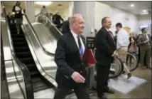  ?? J. SCOTT APPLEWHITE — THE ASSOCIATED PRESS ?? Rep. Leonard Lance, R-N.J., walks through the Capitol after the House passed a budget, with Lance voting nay, that will boost President Donald Trump’s promise to cut taxes, in Washington, Thursday.