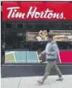 ?? THE CANADIAN PRESS ?? Tim Hortons called the franchisee­s’ proposed class action Friday “another unfounded lawsuit.”
