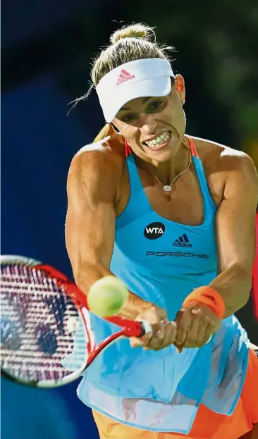  ?? — Reuters ?? Charging to the top: Germany’s Angelique Kerber returns a shot to Ana Konjuh of Croatia in the quarter-finals of the Dubai Championsh­ips on Thursday. Kerber won 6-3, 6-2.