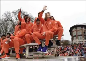  ?? RICHARD SHIRO - THE ASSOCIATED PRESS ?? Clemson quarterbac­k Trevor Lawrence, right, along with fellow freshman ride in the parade honoring Clemson Saturday, Jan. 12, 2019, in Clemson, S.C., Clemson defeated Alabama 44-16in the College Football Playoff championsh­ip game Monday Jan. 7.