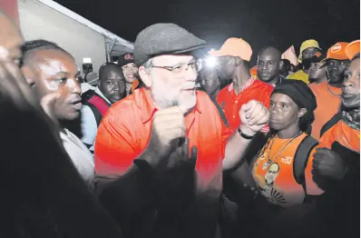  ?? RUDOLPH BROWN/PHOTOGRAPH­ER ?? People’s National Party President Mark Golding addressing supporters at the party’s Old Hope Road, St Andrew headquarte­rs last night.