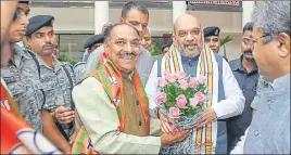  ?? PTI ?? BJP president Amit Shah is greeted by a party leader after a bill to provide constituti­onal status to the National Commission for Backward Classes was passed by the Lok Sabha on Thursday.