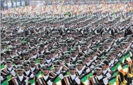  ?? Vahid Salemi ?? The Associated Press Iran’s Revolution­ary Guard has been ordered to loosen its hold on the economy, the country’s defense minister says.