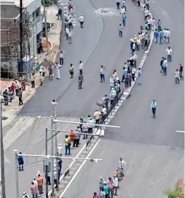  ?? — S. SURENDER REDDY ?? A long queue to buy liquor was witnessed at Patny Circle in Secunderab­ad on Wednesday. Wine shops in the city opened after 42 days of lockdown.