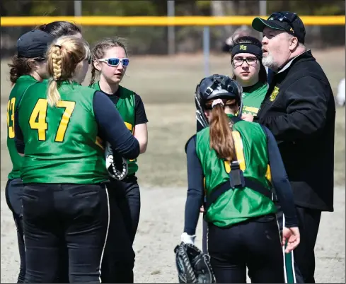  ?? Photo by Jerry Silberman
/ risportsph­oto.com ?? Paul Mercier addresses members of the North Smithfield softball team during an April 2019 game against Coventry. Mercier stepped down as the Northmen’s head coach after last season to become the hitting coach/recruiting director for the softball program at CCRI. Alas, the Knights’ season barely got off the ground due to COVID-19.