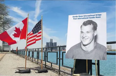  ?? DAVE CHIDLEY/THE CANADIAN PRESS FILES ?? A photo of hockey great Gordie Howe was unveiled during the announceme­nt in May 2015 that a new bridge will be named the Gordie Howe Internatio­nal Bridge in Windsor, Ont. Bridging North America is expected to start major constructi­on in the fall.