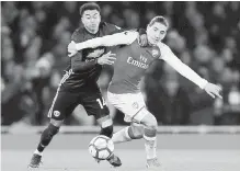  ?? AP ?? Manchester United’s Jesse Lingard, left, and Arsenal’s Hector Bellerin vie for the ball during their match in London on Saturday.