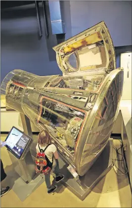  ?? [STEVE STEPHENS/DISPATCH] ?? A young visitor learns about the harrowing mission of Gemini 8, Armstrong’s first ride into space.