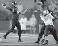  ?? Arkansas Democrat-Gazette/Thomas Metthe ?? WOLVES UP: Arkansas State quarterbac­k Justice Hansen (15) throws a pass during the third quarter of the Red Wolves’ 27-20 win on Saturday against UNLV at Centennial Bank Stadium in Jonesboro.