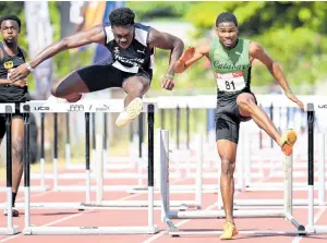  ?? PHOTOS BY RICARDO MAKYN/CHIEF PHOTO EDITOR ?? Zacre Braham (right) of Calabar High wins his Class One 110m hurdles heat in 14.46 seconds ahead of Joshua Edwards of Jamaica College at last Saturday’s McKenleyWi­nt Classics at Calabar.
