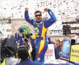  ?? Ian C. Bates / The Chronicle 2013 ?? Martin Truex Jr. celebrates his win in 2013 at the Toyota/Save Mart 350 at Sonoma Raceway.