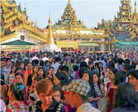  ?? AP ?? Buddhists visit Myanmar Shwedagon pagoda on the full moon day of Tabaung, the last month of Myanmar calendar, in Yangon, on Sunday. —