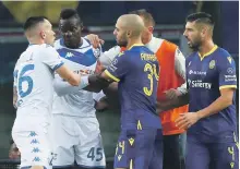  ?? EPA ?? A furious Mario Balotelli, second left, after the Brescia striker was racially abused by home fans at Verona last month